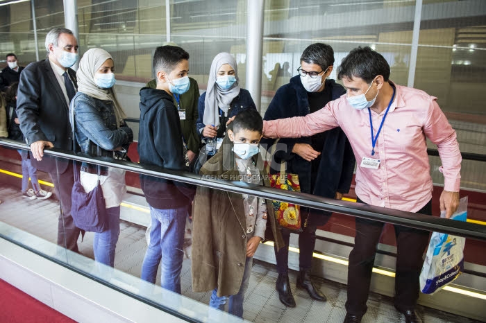 Arrivée en France de réfugiés, via les “couloirs humanitaires".