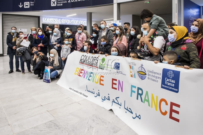 Arrivée en France de réfugiés, via les “couloirs humanitaires".