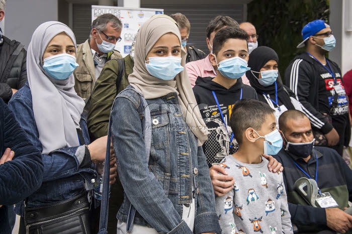Arrivée en France de réfugiés, via les “couloirs humanitaires".